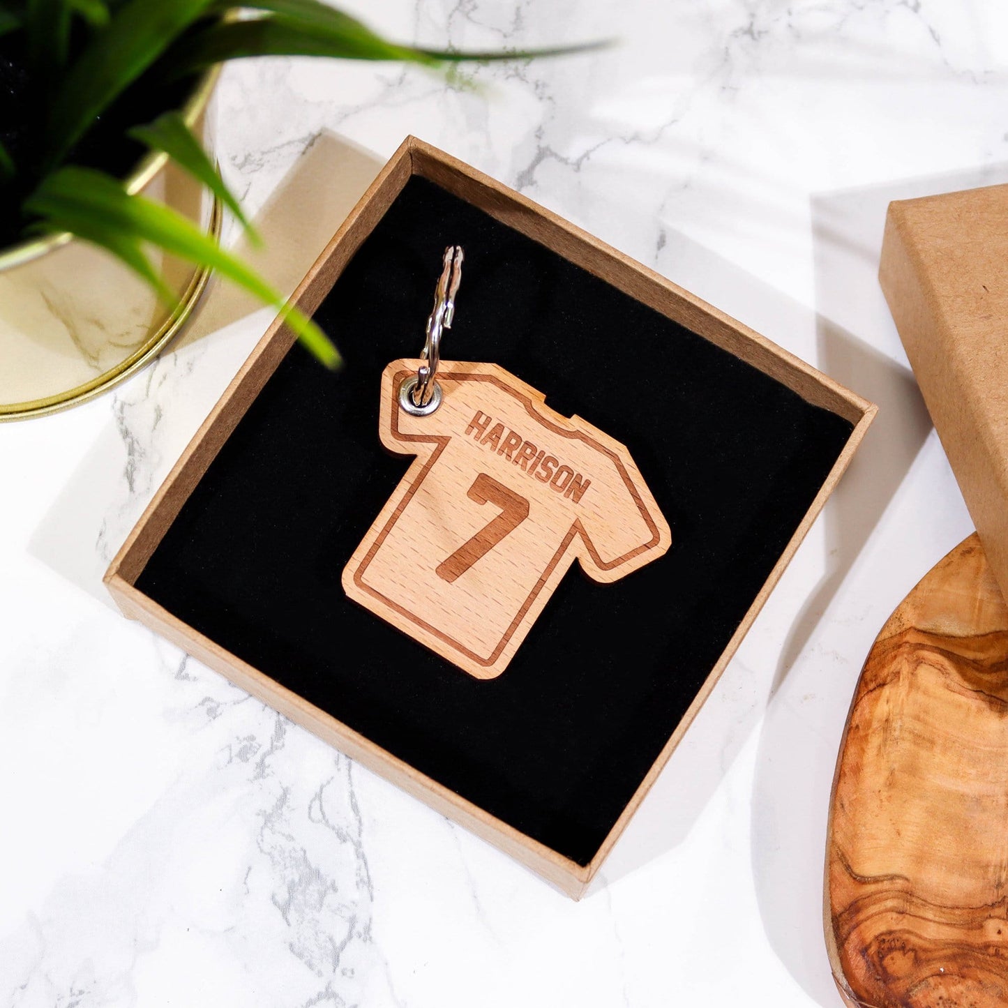 T shirt shaped wooden keyring with personalised name and number by Original Monkey Gifts.