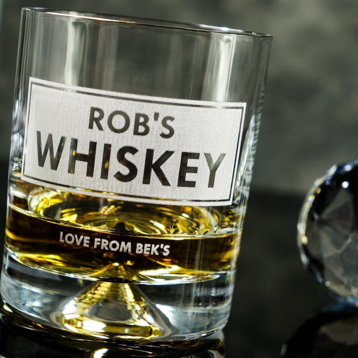 a personalised whiskey tumbler with heavy base and detailing, professionally engraved