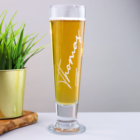 a personalised glass with the recipients name the role that they have in the wedding and the wedding date is also engraved