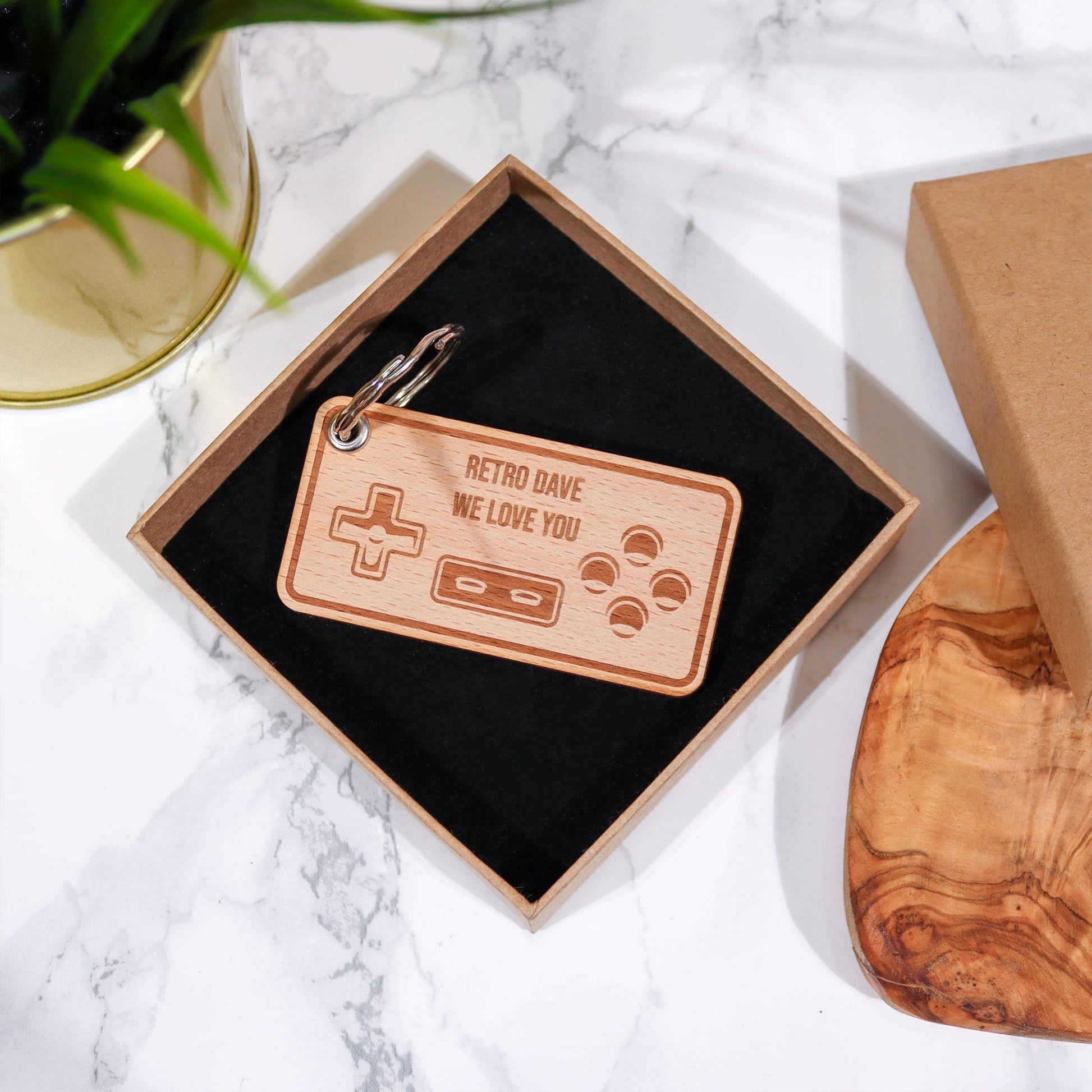 Wooden keyring with a games controller engraved and personalised message by Original Monkey Gifts.